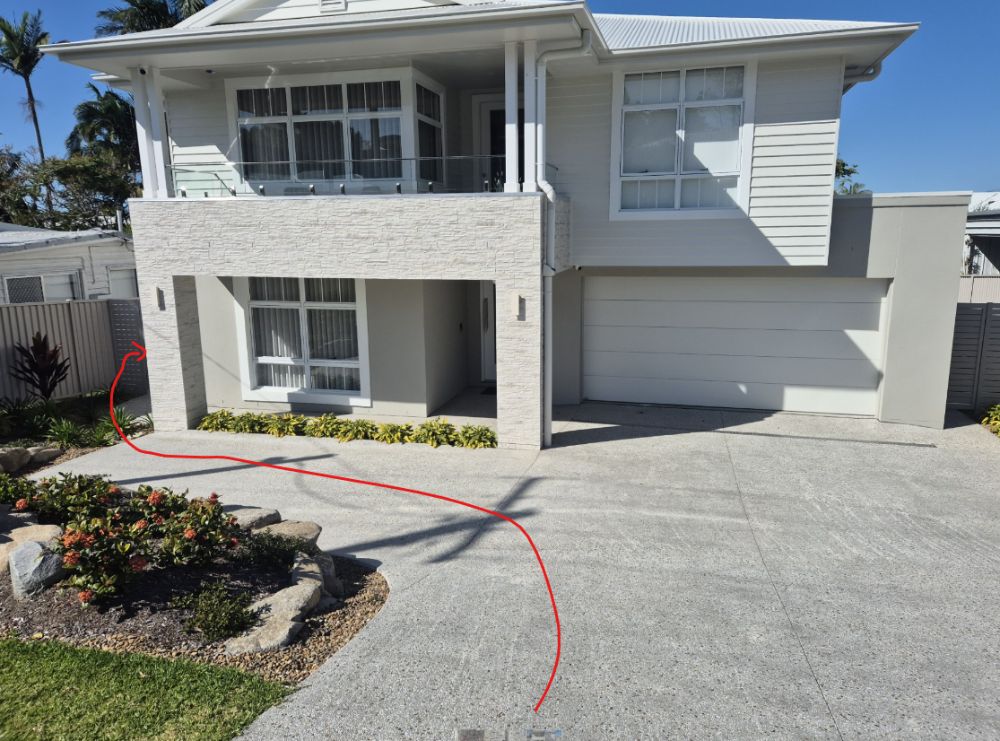 The driveway at 19 Anthony Avenue, with the walking route to the side gate marked in red